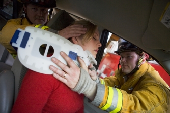 Rescuers rescuing a women from an accident